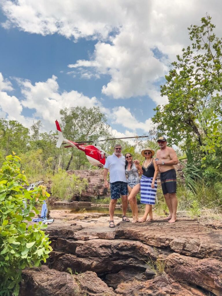 Family enjoying helicopter tour and ready for swimming in Litchfield National Park