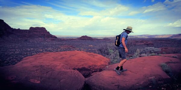 Man walking on mountain at Palm Valley