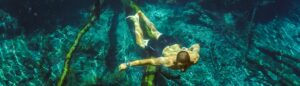man swimming underwater in Mataranka thermal pools northern territory