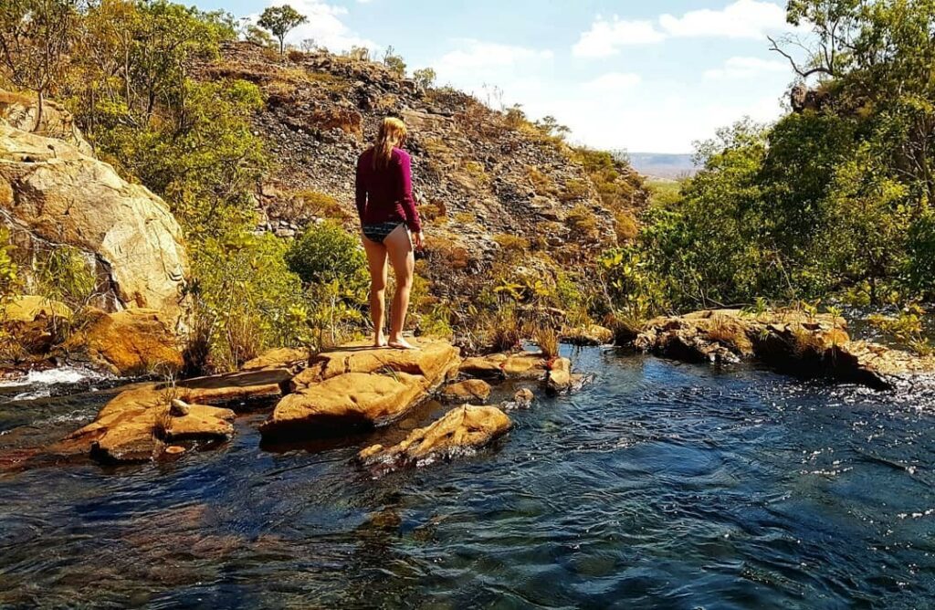 woman on some rocks in the water on the Jatbula Trail in Nitmiluk National Park Northern Territory