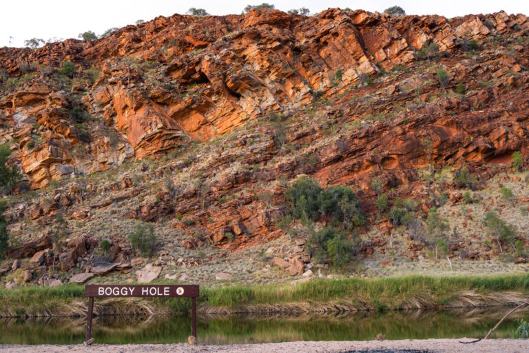 beautiful photo of finke gorge national park with the boggy hole sign