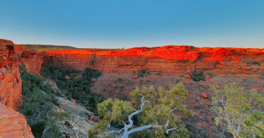 sunset at Kings Canyon with blue skys and orange rock cliffs